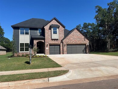 View of property featuring a front lawn
