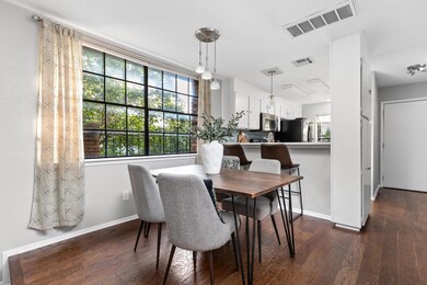 Dining space featuring dark wood-style flooring, 