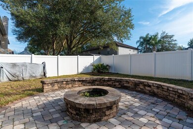 Huge pavered fire pit and sitting wall