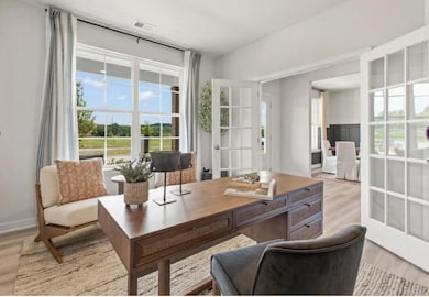 Office space featuring light wood-type flooring