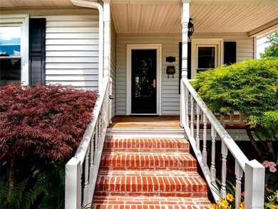 Step through the custom designed mahogany door wit