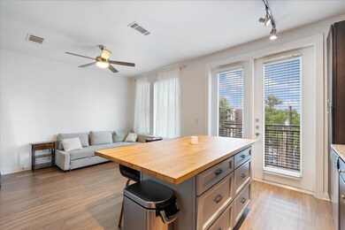 Kitchen with butcher block countertops, light woo