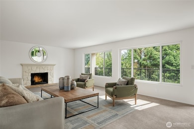 large living room with large windows & wood fireplace *virtually staged*