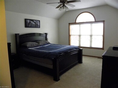Master bedroom offers vaulted ceilings and plenty 