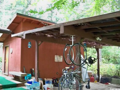 Attached to carport are two rooms perfect for an a