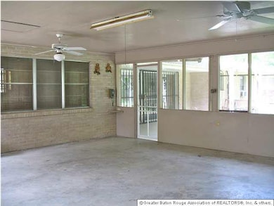 Screened room looking to kitchen and patio