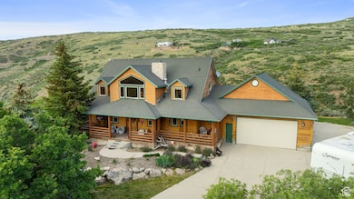 View of front of home featuring covered porch, concrete driveway, an attached garage, a mountain view, and roof with shingles