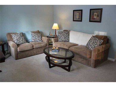 Living Room. 12.6x 15.6 , beige carpet, light teal