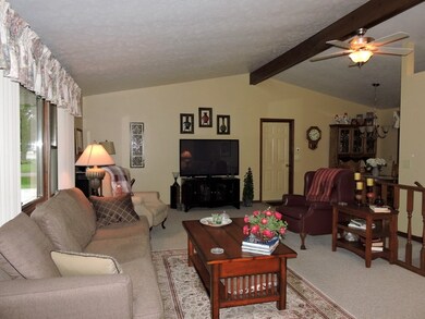 Vaulted ceiling with fan/light.