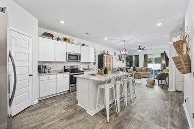 Kitchen with stainless steel appliances, white cab