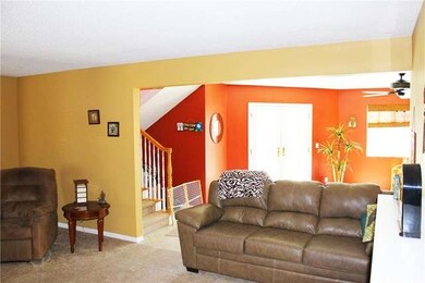 Living room opens to family room and stairway to u
