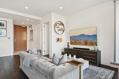 Living room featuring dark hardwood / wood-style flooring