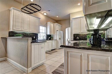 Upscaled kitchen, granite tops under cabinet lighting.