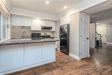 Kitchen with black appliances, kitchen peninsula, 