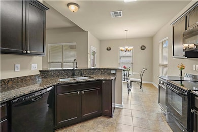 Kitchen view to dining area and backyard