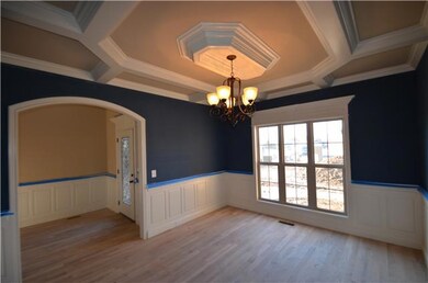 Formal Dining with extensive custom trim, wainscoting and solid oak hardwood flooring.