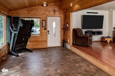 Front door steps up to living room
