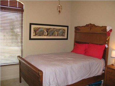 Front bedroom with tall ceilings.