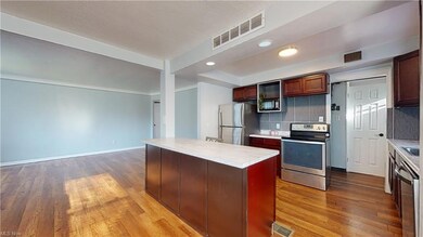 Kitchen features an island with space for seating 