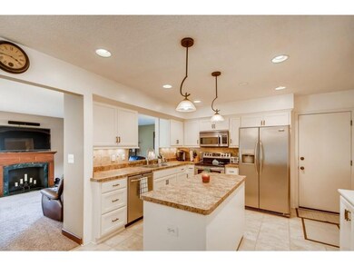 The eat-in kitchen has stainless appliances and a 