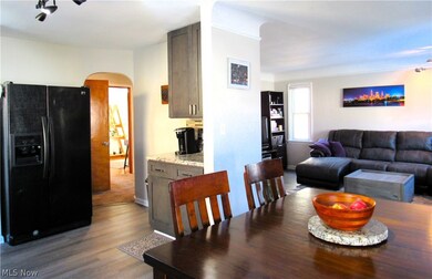 Dining room with dark hardwood / wood-style floors