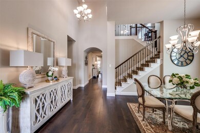 Grand foyer entrance featuring an elegant chandeli