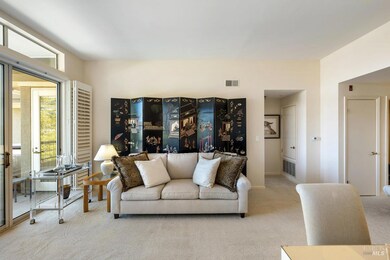 Plantation-style shutters on sliding glass windows conveniently fold back for full light.