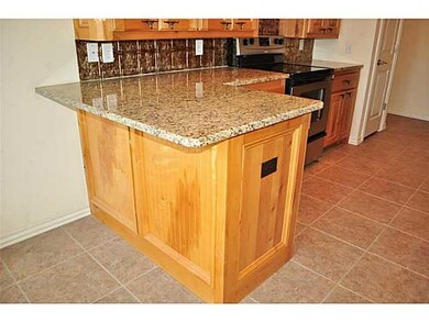 Kitchen. Extended breakfast bar complete with gran