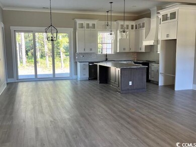 Kitchen featuring a center island, pendant lightin