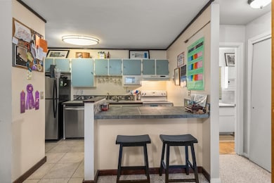 Kitchen featuring appliances with stainless steel
