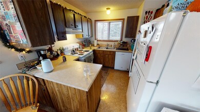 Looking from open dining area into kitchen