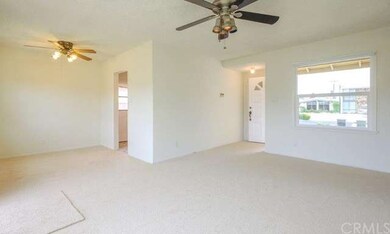 The living room and dining area provide an open fu
