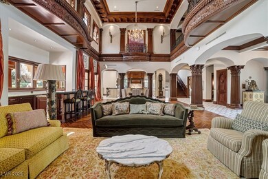 Building lobby with crown molding, a towering ceil