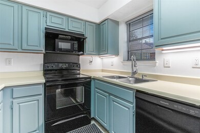 Recently painted cabinets in kitchen. Sink window overlooks pool.