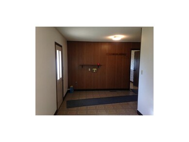 Large laundry room off kitchen with door to back y