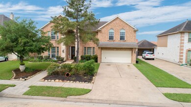 Brick home beautifully landscaped.