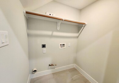 This photo shows a compact laundry room with washe