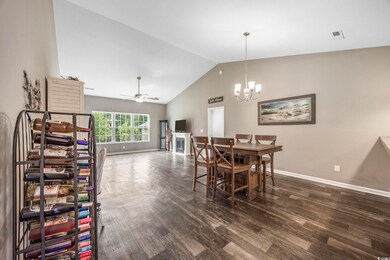 Dining space featuring ceiling fan with notable ch