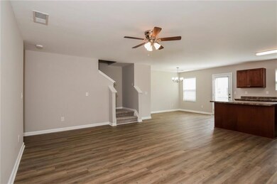 Unfurnished living room with ceiling fan with nota