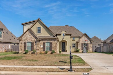 French country inspired facade featuring stucco si