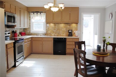 Large eat in kitchen with wood look ceramic tile f