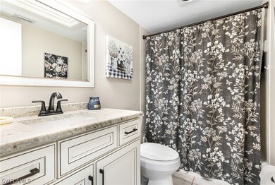 Bathroom featuring tile patterned flooring, toilet