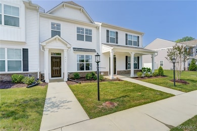 Multi unit property featuring stone siding, a fron