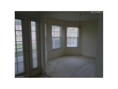 Dining with large windows and pass thru to kitchen