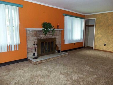 Living Room. Stone log burning fireplace
