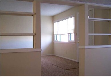 First of two living room spaces with a huge pictur