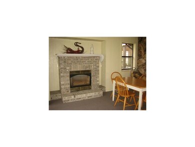 Porch. Gas fireplace on year-round porch keeps eve