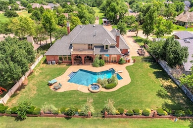 View of pool with a lawn and a patio area