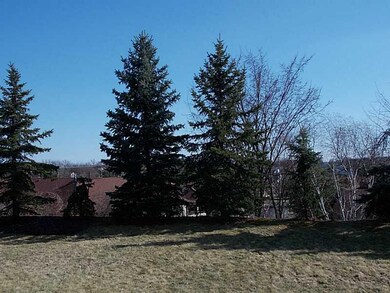 Exterior Front. tree lined rear yard