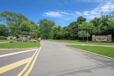 View of asphalt street featuring curbs